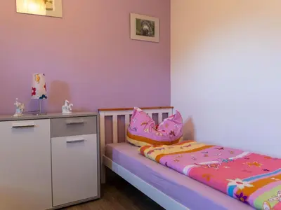 Ein Bett oder Betten in einem Zimmer der Unterkunft Apartment mit zwei Schlafzimmern und Balkon by Interhome