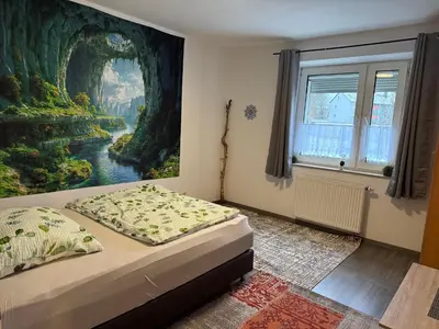 Ein Bett oder Betten in einem Zimmer der Unterkunft Nice Ferienwohnung Bayreuth