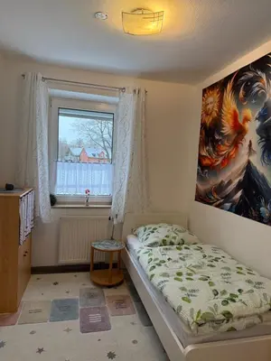 Ein Bett oder Betten in einem Zimmer der Unterkunft Nice Ferienwohnung Bayreuth