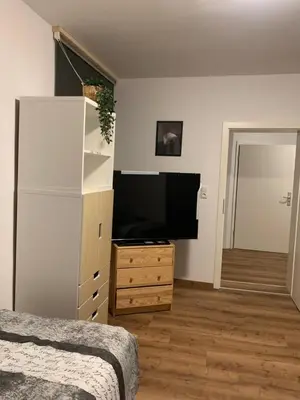 Ein Bett oder Betten in einem Zimmer der Unterkunft B16 City-Apartment, zentrales City-Apartment mit 4 Betten