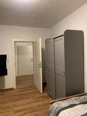 Ein Bett oder Betten in einem Zimmer der Unterkunft B16 City-Apartment, zentrales City-Apartment mit 4 Betten