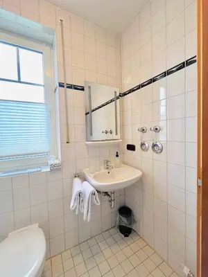 Ein Badezimmer in der Unterkunft Pension Lutter