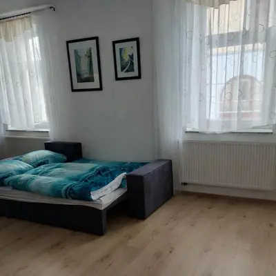Ein Bett oder Betten in einem Zimmer der Unterkunft Ferienwohnung Lengenfeld