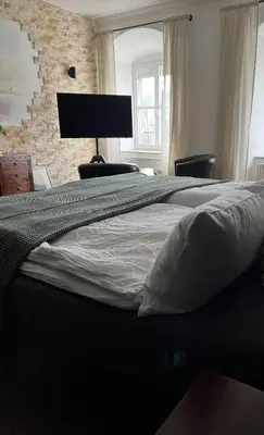 Ein Bett oder Betten in einem Zimmer der Unterkunft Schloss1611 B&B