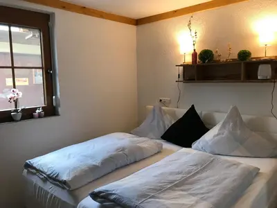 Ein Bett oder Betten in einem Zimmer der Unterkunft Rennerhof-Siebeneichen Fewo Waschbär