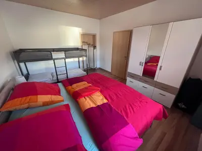 Ein Bett oder Betten in einem Zimmer der Unterkunft Ferienwohnung Arnoldshammer
