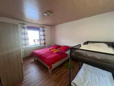 Ein Bett oder Betten in einem Zimmer der Unterkunft Ferienwohnung Arnoldshammer