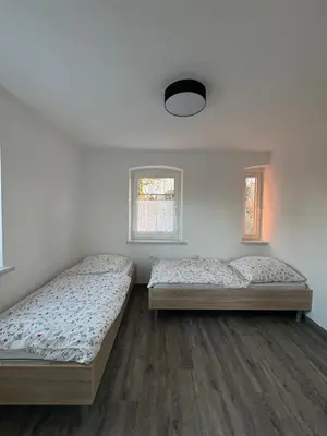 Ein Bett oder Betten in einem Zimmer der Unterkunft Seeperle Weißenstadt Wohnung Schneeberg