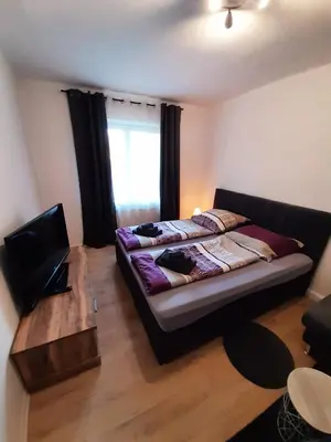 Ein Bett oder Betten in einem Zimmer der Unterkunft Heubi 6 Appartment 2 Schlafzimmer