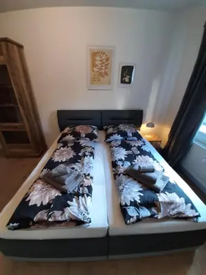 Ein Bett oder Betten in einem Zimmer der Unterkunft Heubi 6 Appartment 2 Schlafzimmer