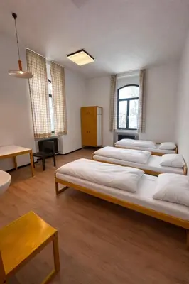 Ein Bett oder Betten in einem Zimmer der Unterkunft Villa Vanel - Pension Hotel