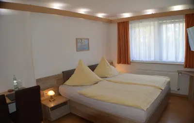 Ein Bett oder Betten in einem Zimmer der Unterkunft Hotel und Restaurant Feustel