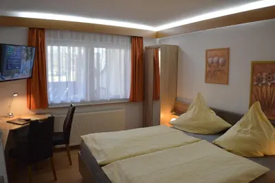Ein Bett oder Betten in einem Zimmer der Unterkunft Hotel und Restaurant Feustel