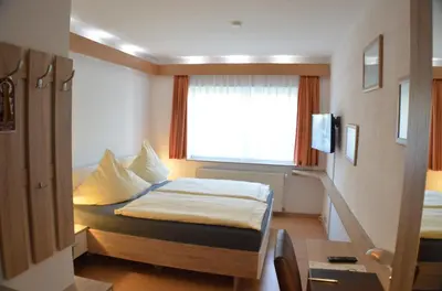 Ein Bett oder Betten in einem Zimmer der Unterkunft Hotel und Restaurant Feustel