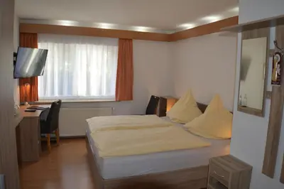 Ein Bett oder Betten in einem Zimmer der Unterkunft Hotel und Restaurant Feustel