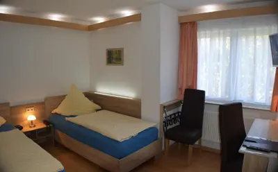 Ein Bett oder Betten in einem Zimmer der Unterkunft Hotel und Restaurant Feustel