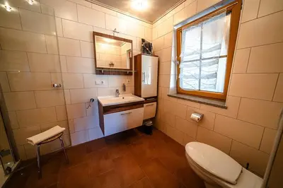 Ein Badezimmer in der Unterkunft Ferienhof Kosertal - Erlebnisbauernhof, Reitstall & Spa