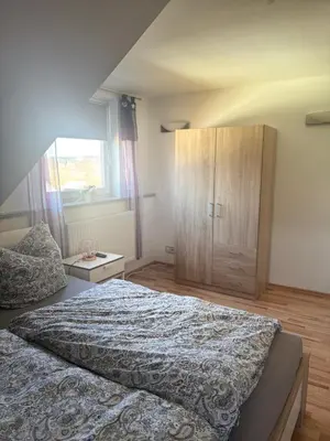 Ein Bett oder Betten in einem Zimmer der Unterkunft Ferienwohnung Schaller