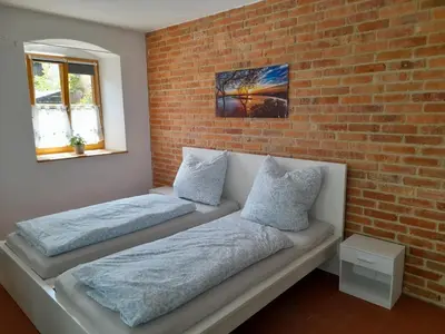 Ein Bett oder Betten in einem Zimmer der Unterkunft Ferienwohnung Am Pulverturm