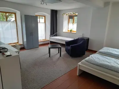 Ein Bett oder Betten in einem Zimmer der Unterkunft Ferienwohnung Am Pulverturm