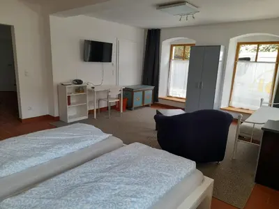 Ein Bett oder Betten in einem Zimmer der Unterkunft Ferienwohnung Am Pulverturm