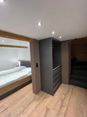 Ein Bett oder Betten in einem Zimmer der Unterkunft Fichtelrooms