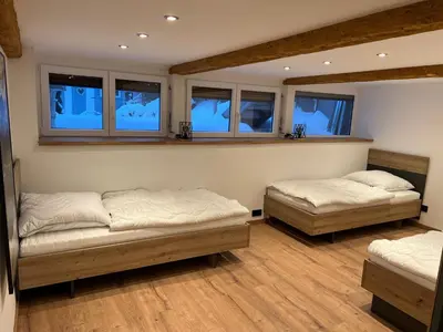 Ein Bett oder Betten in einem Zimmer der Unterkunft Fichtelrooms