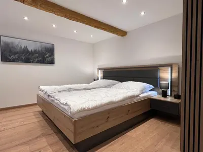 Ein Bett oder Betten in einem Zimmer der Unterkunft Fichtelrooms