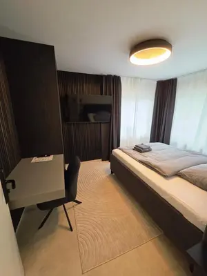 Ein Bett oder Betten in einem Zimmer der Unterkunft Pension Sleep&Stay Hersbruck