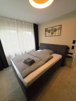 Ein Bett oder Betten in einem Zimmer der Unterkunft Pension Sleep&Stay Hersbruck