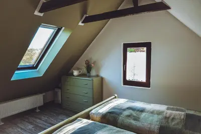 Ein Bett oder Betten in einem Zimmer der Unterkunft Ferienhaus Vogtland mit Sauna und Hot Tub