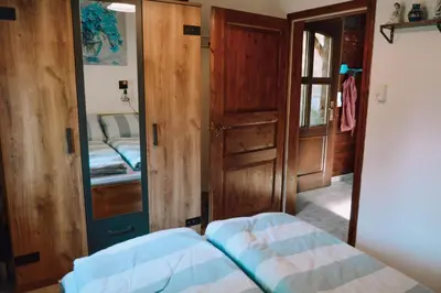 Ein Bett oder Betten in einem Zimmer der Unterkunft Ferienhaus Vogtland mit Sauna und Hot Tub
