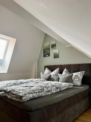 Ein Bett oder Betten in einem Zimmer der Unterkunft Dachblick by Zirwick Apartment