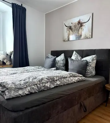 Ein Bett oder Betten in einem Zimmer der Unterkunft Wohnzeit by Zirwick Apartment