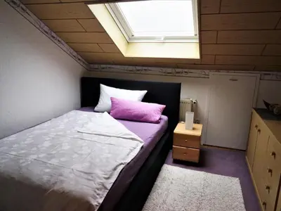 Ein Bett oder Betten in einem Zimmer der Unterkunft Apartment Große Ferienwohnung in Stadtsteinach by Interhome
