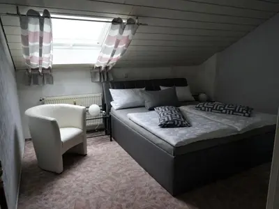 Ein Bett oder Betten in einem Zimmer der Unterkunft Apartment Große Ferienwohnung in Stadtsteinach by Interhome