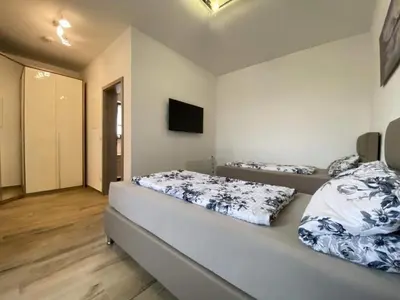 Ein Bett oder Betten in einem Zimmer der Unterkunft Apartment in Heselbach mit Grill- Whirlpool und Garten by Interhome