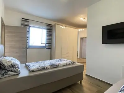 Ein Bett oder Betten in einem Zimmer der Unterkunft Apartment in Heselbach mit Grill- Whirlpool und Garten by Interhome