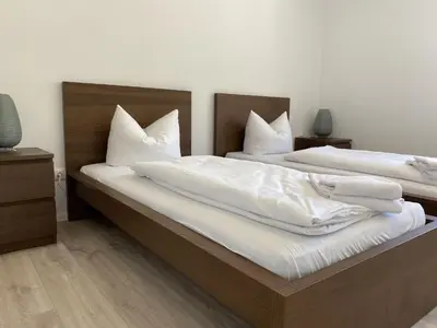 Ein Bett oder Betten in einem Zimmer der Unterkunft Apartment SAD151 Moderne Monteurwohnung mit Balkon by Interhome