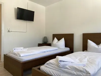Ein Bett oder Betten in einem Zimmer der Unterkunft Apartment SAD151 Moderne Monteurwohnung mit Balkon by Interhome