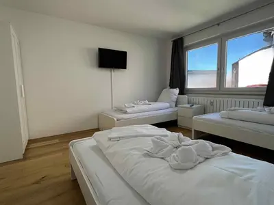 Ein Bett oder Betten in einem Zimmer der Unterkunft Apartment SAD154 by Interhome