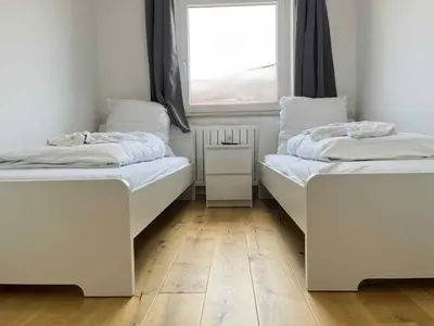 Ein Bett oder Betten in einem Zimmer der Unterkunft Apartment SAD154 by Interhome