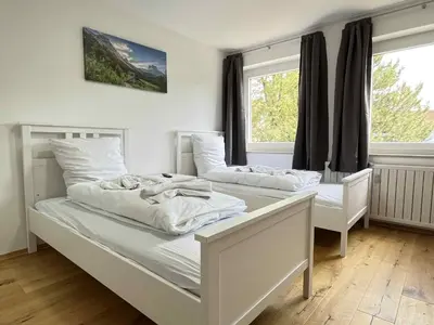 Ein Bett oder Betten in einem Zimmer der Unterkunft Apartment SAD153 by Interhome