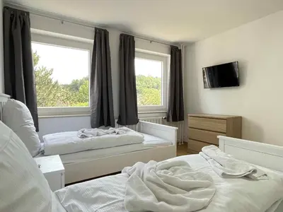 Ein Bett oder Betten in einem Zimmer der Unterkunft Apartment SAD153 by Interhome
