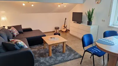 Ein Sitzbereich in der Unterkunft Sunset Apartment
