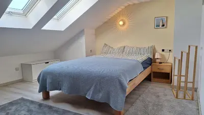 Ein Bett oder Betten in einem Zimmer der Unterkunft Sunset Apartment