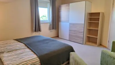 Ein Bett oder Betten in einem Zimmer der Unterkunft Sunset Apartment