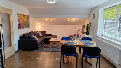 Ein Sitzbereich in der Unterkunft Sunset Apartment