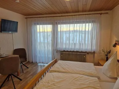 Ein Bett oder Betten in einem Zimmer der Unterkunft Gasthof Siebenstern