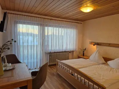Ein Bett oder Betten in einem Zimmer der Unterkunft Gasthof Siebenstern